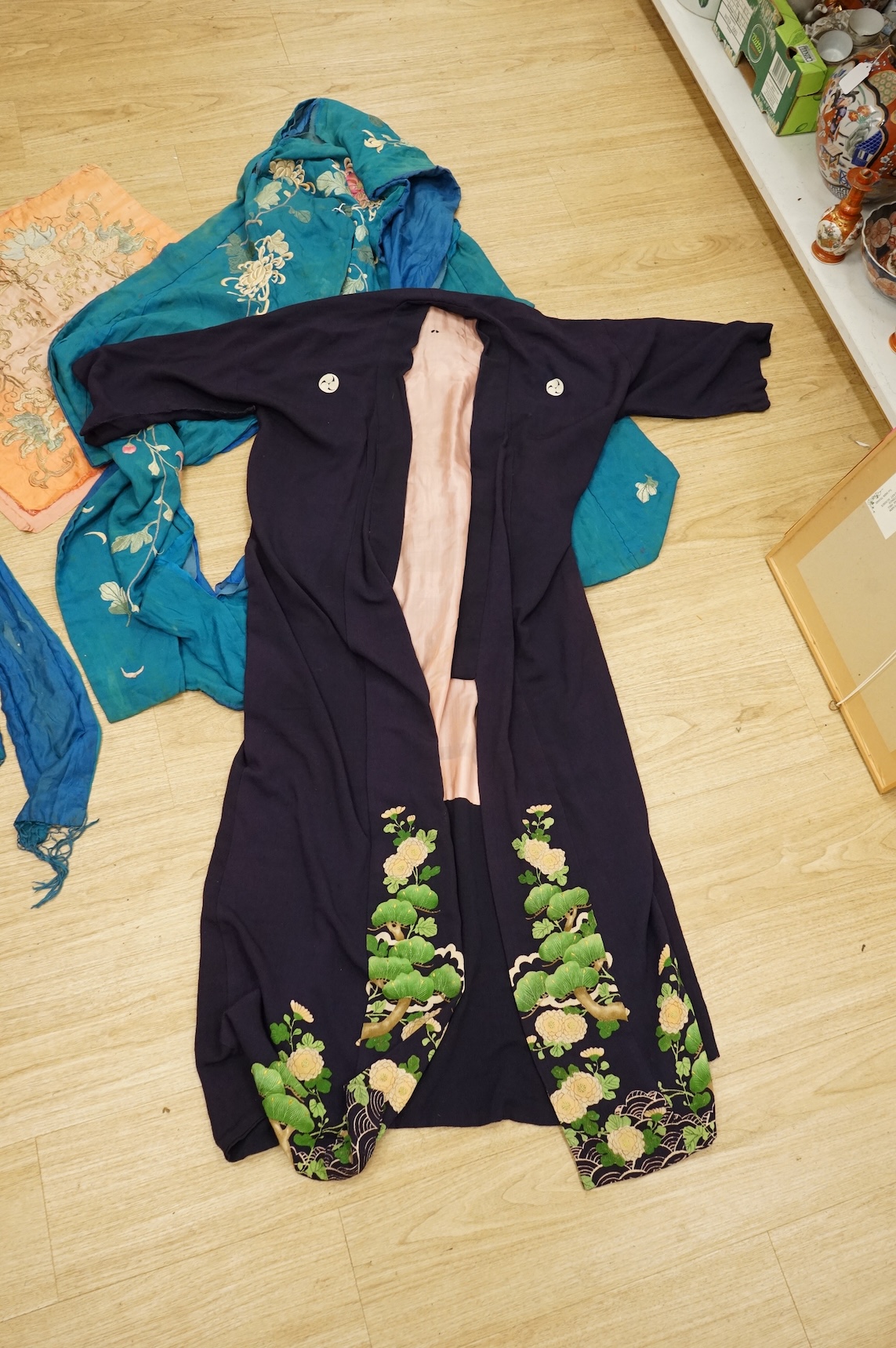 A collection of Chinese and Japanese embroidered kimonos and textiles